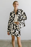Tasha Cow Print Mini Skirt