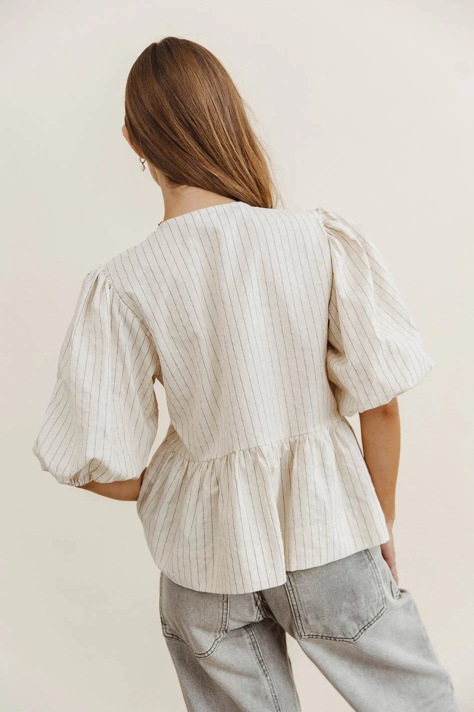 Corey Peplum Top in Tan