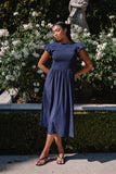 Harshell Smocked Midi Dress