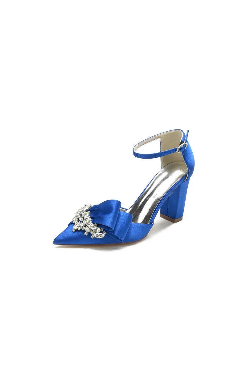 White Satin Heels Featuring a Large Decorative Bow and Metallic Heel