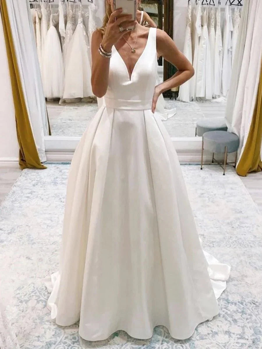 Ivory A Line Deep V Neck Long Wedding Dress with Bowknot