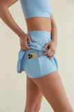 Avery Smoothing Flare Tennis Skort in Blue